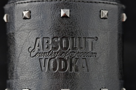 Kiev, Ukraine - June 05, 2011: Absolut Vodka Rock Edition symbol on black leather surface.のeditorial素材