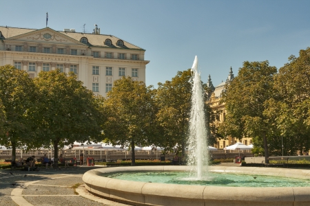 ZAGREB, CROATIA - AUGUST 21: People have a rest in shady park with fountain in front of The Regent Esplanade Hotel in Zagreb, Croatia on August 21, 2012. Hotel was built in 1925.のeditorial素材