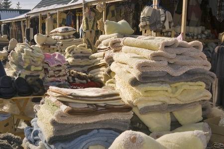 Homemade different clothes and goods selling on the marketの写真素材