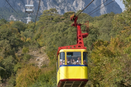 MISHOR, CRIMEA, UKRAINE - SEPTEMBER 16: People travel by rope way cab on top of Ai-Petri Mountain on Sepember 16, 2012 in Mishor, Ukraine. This road has one of the longest unsupported span in Europe.のeditorial素材