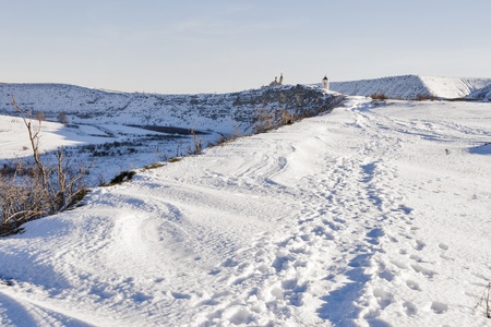 winter snow road to old Orhei Vechi monastery in Moldovaの写真素材