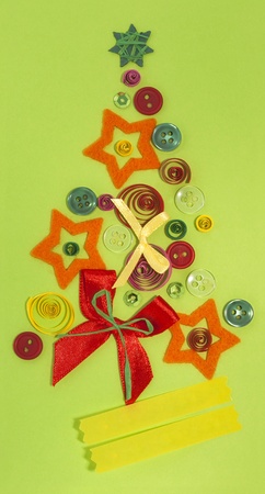 homemade light green Christmas card made of buttons, ribbons, bowsの写真素材
