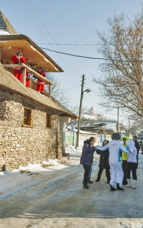 ORHEI VECHI, MOLDOVA - DECEMBER 31  People dance celebrating Christmas on a rural winter street in the Moldovan village on December 31, 2012 in Orhei Vechi, Moldova のeditorial素材
