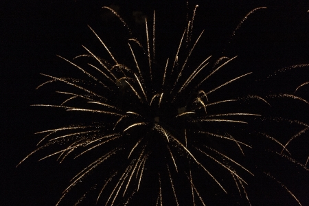 A bright burst of fireworks against black skyの写真素材