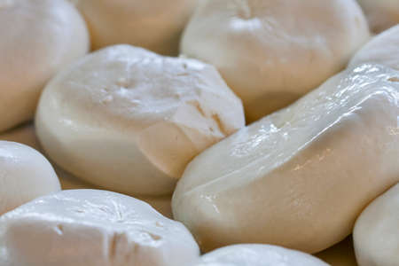Fresh mozzarella pieces closeup backgroundの写真素材