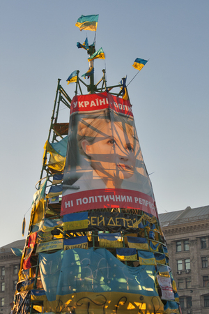 KIEV, UKRAINE - DECEMBER 14: Christmas tree decorated with flags and placards on Independence Square EuroMaidan during peaceful actions against the Ukrainian president and government on December 14, 2013 in Kiev, Ukraine. The protests were provoked when tのeditorial素材