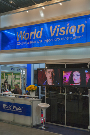Visitors visit World Vision satellite digital equipment booth at Kyiv International exhibition and conference in broadcast industry 2012 in Kiev, Ukraine. EEBC is the largest in Ukraine international exhibition and conference of broadcast industry.のeditorial素材
