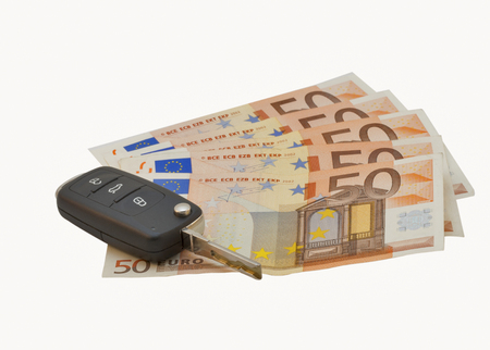 Car keys isolated over the fifty euro banknotesの写真素材