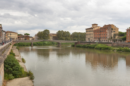 Ponte della Fortezza over Arno River and waterfront buildings, Pisa. Tuscany, Italy.の写真素材
