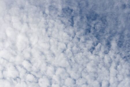 blue sky and fluffy clouds background