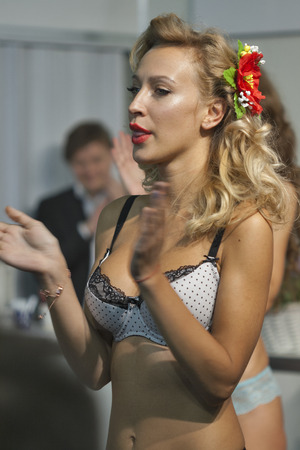 KIEV, UKRAINE - AUGUST 28, 2014: Fashion lingerie model at Kyiv Fashion 2014 show in KyivExpoPlaza exhibition center. It was the 27th edition of the popular Kyiv Fashion International Vogue Festival.のeditorial素材
