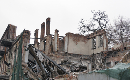 Fire destroyed old residential brick houseの写真素材