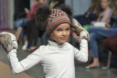 KIEV UKRAINE  AUGUST 28 2014: Association of Children's Fashion little girl model walks the runway at Kyiv Fashion 2014 show in KyivExpoPlaza exhibition center. It was the 27th edition of the popular Kyiv Fashion International Vogue Festival.のeditorial素材