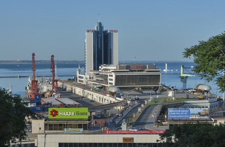 ODESSA, UKRAINE - JULY 15, 2014: People walk along bridge to Marine Passenger Station and Hotel Odessa. It is a 4-star hotel built in 2001 and formerly belonged to the Kempinski hotel chain.のeditorial素材