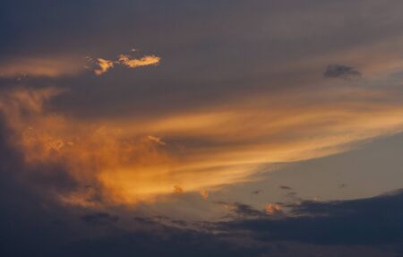 dramatic sunset sky with orange clouds