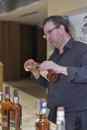 KIEV, UKRAINE - NOVEMBER 21, 2015: David Keir presents The BenRiach and Glendronach Single Malt Scotch Whisky distilleries booth at 1st Ukrainian Whisky Dram Festival in Parkovy Exhibition Center.のeditorial素材