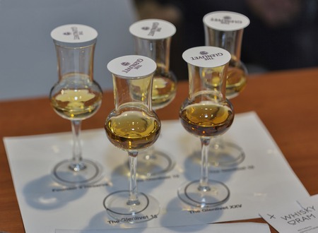 KIEV, UKRAINE - NOVEMBER 21, 2015: Whisky glasses for tasting closeup at corporate presentation of The Glenlivet Single Malt Scotch Whiskey at 1st Whisky Dram Festival in Parkovy Exhibition Center.のeditorial素材