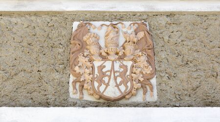 Ancient Coat of Arms bas relief on the outdoor wall of Neo Gothic Parish Church of Saint Martin at Bled lake in Sloveniaの写真素材