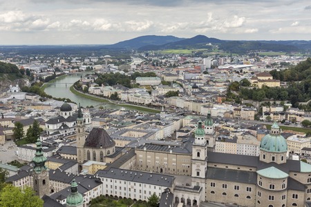 Aerial view over Salzburg historic city center with Catholic Cathedral Salzburger Dom and Salzach river , Austriaの写真素材