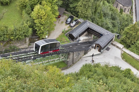 SALZBURG, AUSTRIA - SEPTEMBER 09, 2015: People walk along a funicular cable car railway...