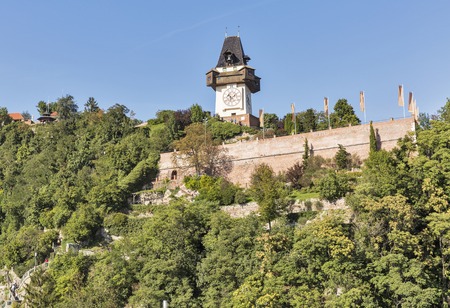 Schlossberg or Castle Hill mountain with old clock tower Uhrturm in Graz, Austria.のeditorial素材
