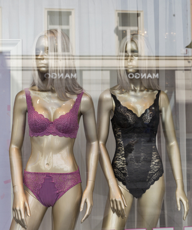 GRAZ, AUSTRIA - SEPTEMBER 12, 2015: Women sexy lingerie mannequins closeup in the Mango store window. Mango is a clothing design and manufacturing company, founded in Barcelona, Catalonia, Spain.のeditorial素材