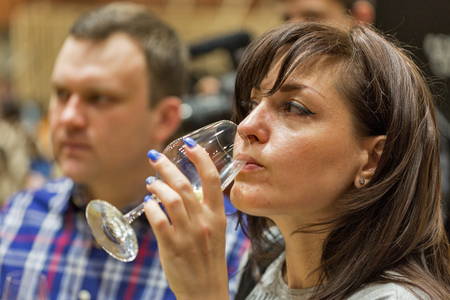 KIEV, UKRAINE - JUNE 04, 2016: Unrecognized visitors taste wine at Kyiv Wine Festival organized by Good Wine company in Parkovy Exhibition Center.のeditorial素材