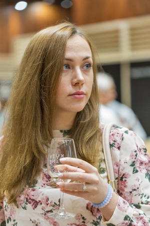KIEV, UKRAINE - JUNE 04, 2016: Unrecognized visitor taste white wine at Kyiv Wine Festival organized by Good Wine company in Parkovy Exhibition Center.のeditorial素材