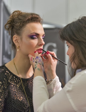 KIEV, UKRAINE - MARCH 25, 2016: Unrecognized woman cosmetologist demonstrates makeup blending skills at 16th National Congress of Beauty Industry Estet Beauty Expo 2016 in IEC.のeditorial素材