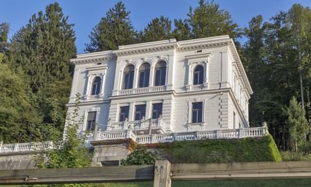 BLED, SLOVENIA - SEPTEMBER 09, 2016: Old white villa facade on the shore of lake Bled. Bled Lake is one of the picturesque sites of the nation.のeditorial素材