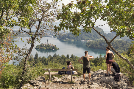 BLED, SLOVENIA - SEPTEMBER 10, 2016: Unrecognized young tourists visit observation point on Osojnica mountain, lake Bled. Bled Lake is one of the picturesque sites of the nation.のeditorial素材