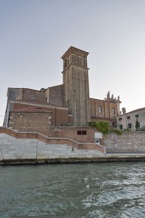 Venice cityscape with Jesuit Church bell tower view from lagoon at sunset, Italy.の写真素材