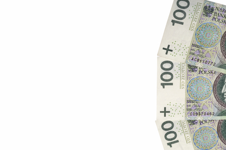 Polish zloty one hundred banknotes on white paper background closeup with copy space.の写真素材