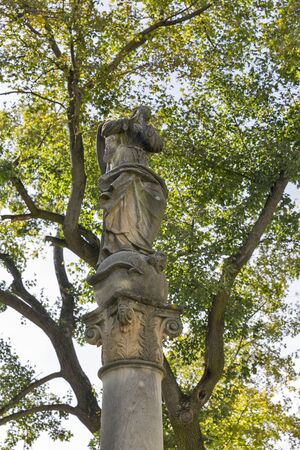 Baroque statue of Virgin Mary in autumn garden of the Festetics palace in Keszthely, Hungary.の写真素材