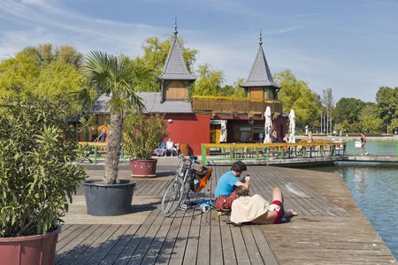 KESZTHELY, HUNGARY - SEPTEMBER 29, 2016: People have a rest on tanning area of bath island Szigetfurdo on lake Balaton. Keszthely, biggest town in the region, is located on the western shore of lake.のeditorial素材