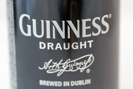 KIEV, UKRAINE - APRIL 17, 2016: Guiness draught beer can closeup. It is one of the most successful beer brands worldwide, an Irish dry stout from the brewery of Arthur Guinness in Dublin, Ireland.のeditorial素材