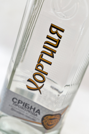 KIEV, UKRAINE - APRIL 17, 2016: Khortytsa Silver Cool vodka bottle closeup on white. Khortytsa brand dominates the alcoholic market of Ukraine, company has most developed sales network in the country.のeditorial素材