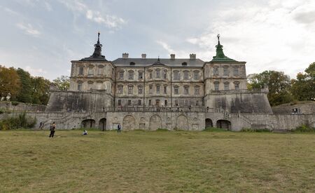 PIDHIRTSI, UKRAINE - OCTOBER 02, 2016: Unrecognized people visit ruined old Pidhirtsi Castle. It is...