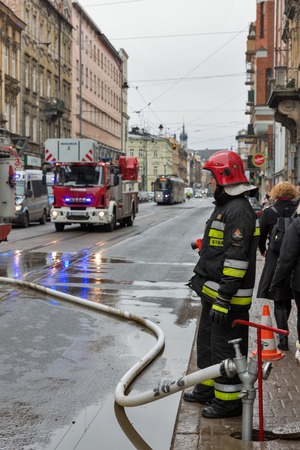 KRAKOW, POLAND - JANUARY 13, 2017: Fire fighting in the city center, Krakowska Street, Kazimierz district. For many centuries Kazimierz was a place of coexistence of Polish and Jewish cultures.のeditorial素材
