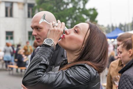 KIEV, UKRAINE - MAY 13, 2017: Unrecognized people taste wine during Kyiv Food and Wine Festival in National Expocenter, a permanent multi-purpose exhibition complex in the Teremky neighborhood.のeditorial素材