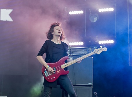 KIEV, UKRAINE - JULY 02, 2017: Ukrainian rock band Sinoptik, winner Global Battle of the Bands 2016, and its bass guitarist Dmitriy Sakir performs live at the Atlas Weekend Festival in Expocenter.のeditorial素材