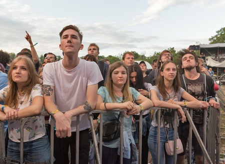 KIEV, UKRAINE - JULY 02, 2017: Young fans enjoy music concert outdoors at the Atlas Weekend music festival in National Expocenter.のeditorial素材