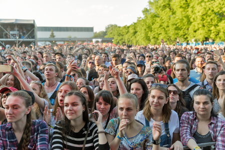 KIEV, UKRAINE - JUNE 29, 2017: Young fans enjoy music concert outdoors at the Atlas Weekend music...