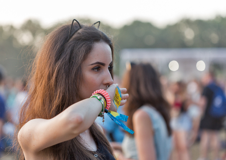 KIEV, UKRAINE - JUNE 29, 2017: Young fans visit music concert outdoors at the Atlas Weekend music festival in National Expocenter.のeditorial素材