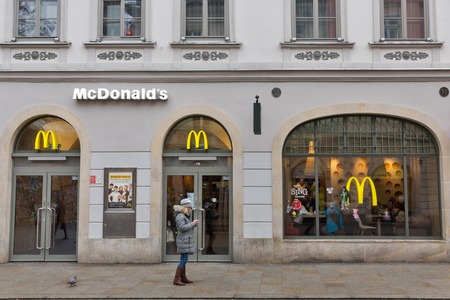 KRAKOW, POLAND - JANUARY 14, 2017: People visit McDonald's restaurant on Florianska street close to Florian Gate in Old Town. McDonald's is the world's largest chain of fast food restaurants.のeditorial素材