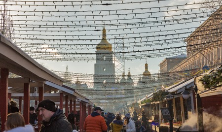KIEV, UKRAINE - JANUARY 03, 2017: People visit Christmas fair on Sophia Square. Formerly the main city square it is situated close to Sophia Cathedral and the St. Michael Monastery.のeditorial素材