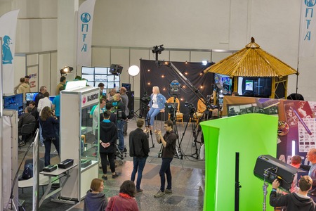 KIEV, UKRAINE - MAY 18, 2017: Unrecognized people visit TV and Radio International Fair in ACCO...