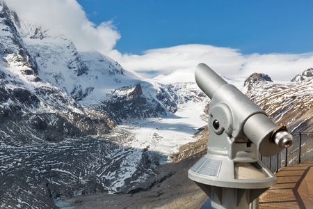 Observation point with telescope. Kaiser Franz Joseph glacier, Grossglockner High Alpine Road in Austrian Alps. Focus on background.の写真素材