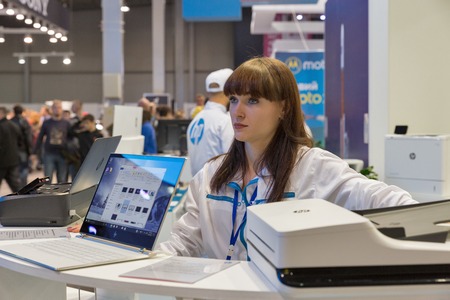 KIEV, UKRAINE - OCTOBER 07, 2017: Presenter works on Hewlett-Packard, multinational information...