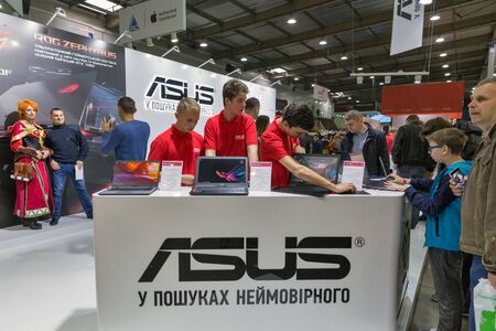 KIEV, UKRAINE - OCTOBER 07, 2017: People visit Asus, a Taiwan based international computer company booth during CEE 2017, the largest electronics trade show of Ukraine in ExpoPlaza Exhibition Center.のeditorial素材